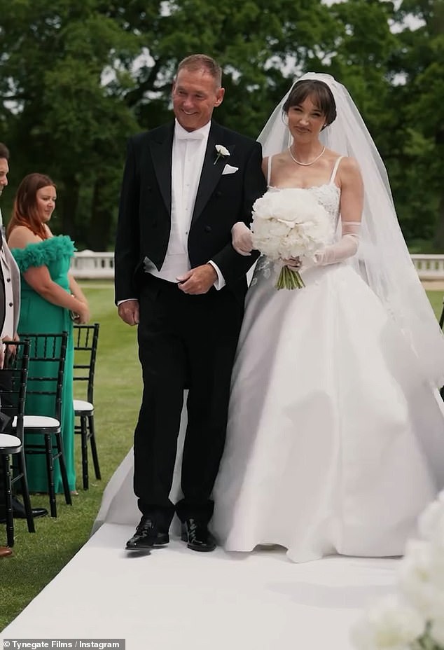 Megan looked elegant as she donned a bespoke flowing white gown from Maison Peter Langner