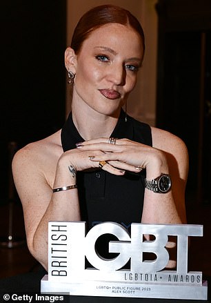 She posed proudly with the gong she accepted on behalf of her partner who was not present