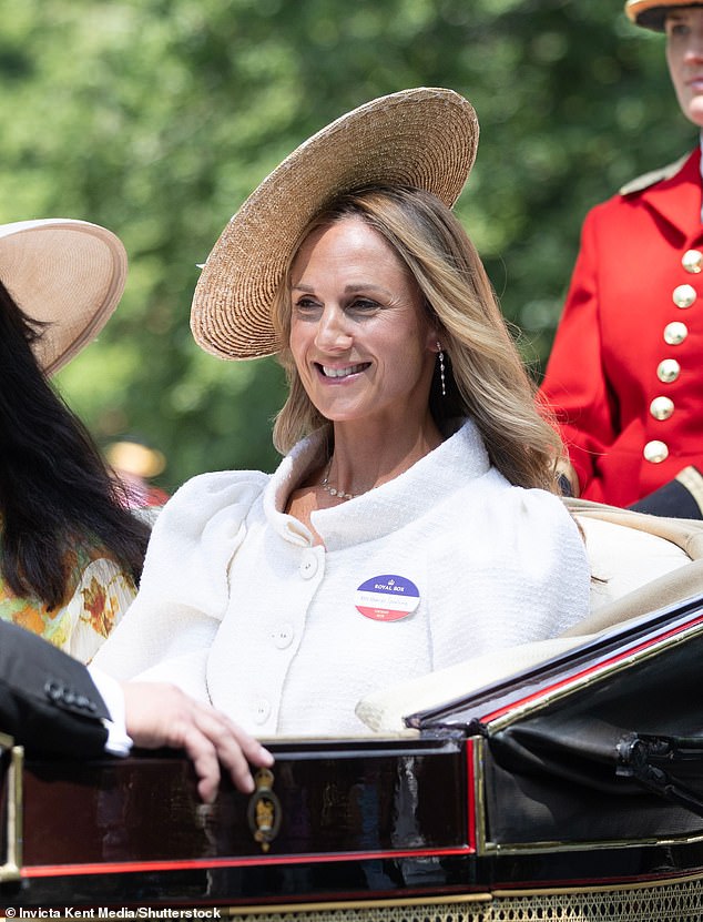 rriet Sperling drives up Water Splash Lane in a carriage on her way to Royal Ascot racecourse
