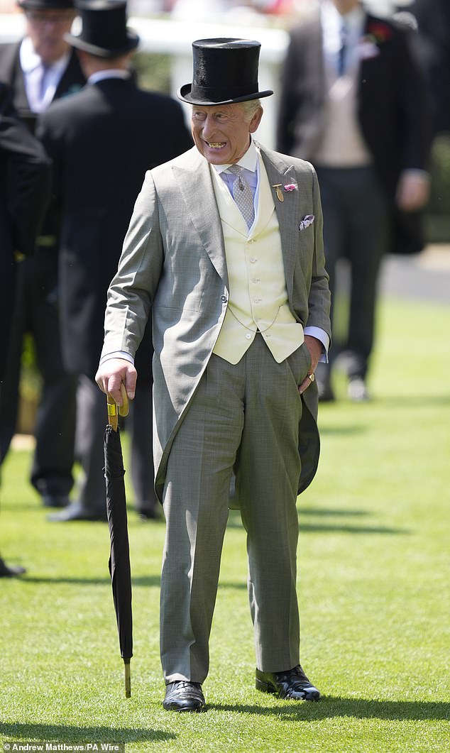 The King dons a yellow waistcoat as he attends day three of Royal Ascot on June 19