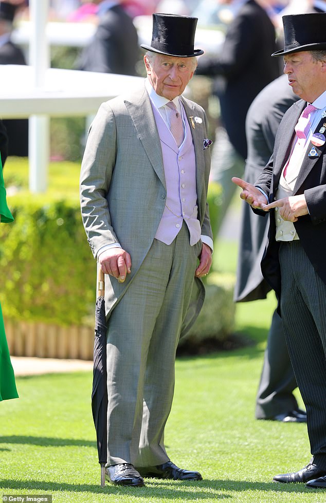 King Charles III speaks to Sir Francis Brooke as he attends day two of Royal Ascot on June 18