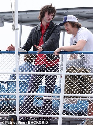The budding actor also sported brown curly hair while shooting scenes on a ferry