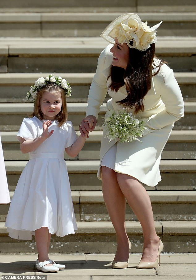 The Duchess of Cambridge and Princess Charlotte on Harry and Meghan's wedding day in 2018. A newspaper report six months later suggested Meghan made Kate cry after they clashed over the wearing of tights with the bridesmaids’ dresses