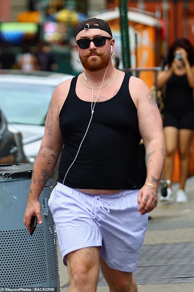 To accessorise the performer kept a low profile in a pair of black tinted sunglasses which they paired with a cap worn backwards