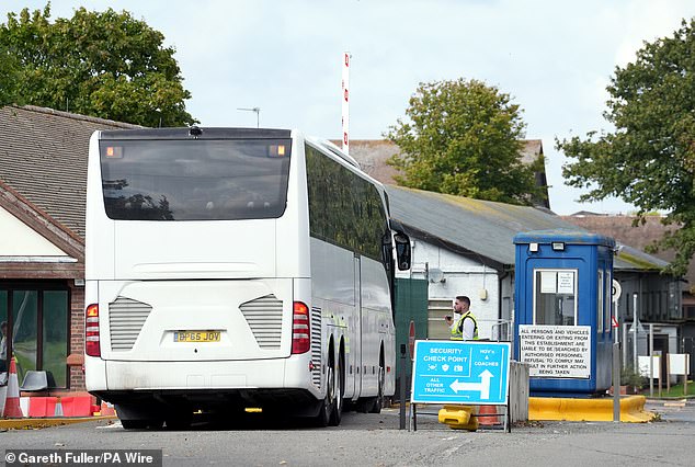 A coach carrying a group of people thought to be migrants arrives at the Migrant Processing Centre in Manston, Kent (file photo)