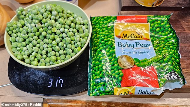 Another upset Aussie claimed they only received 317g of peas in a 500g bag of McCain frozen baby peas they purchased at Woolworths (the peas are pictured on a set of kitchen scales)