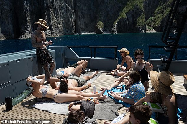 Levine, 46, enjoyed getting some sun on the deck of the boat as the couple hung out with the other families traveling with them on a luxury yacht