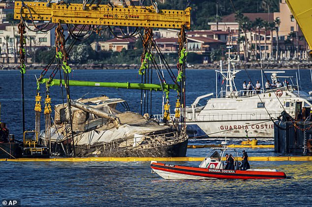 As part of the slow and delicate operation water could be seen pumped out of the Bayesian to lighten her