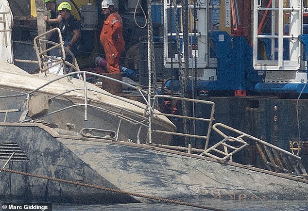 Guardrails at the stern of the Bayesian were bent out of shape and she appeared to be resting at a slight angle in the water in a sling style cradle attached to Hebo Lift 10