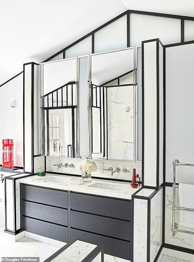 Mackintosh-like steel strips were used to trim the marble slabs in the primary bathroom. The upper panels behind the vanity units were backlit to highlight the lofted ceiling.