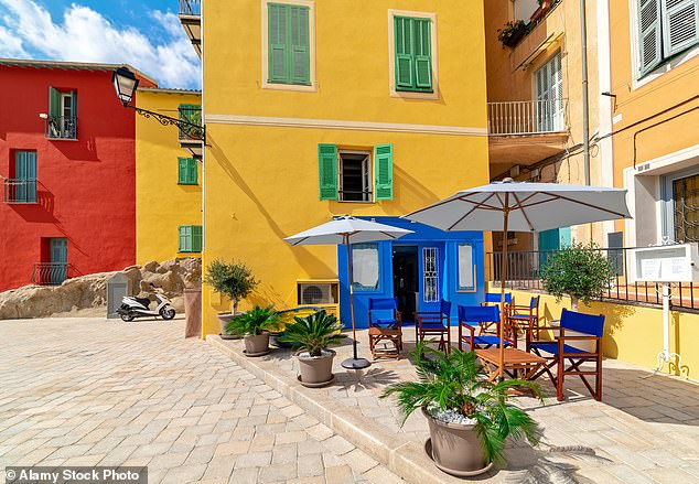 The old town of Menton has narrow ochre-coloured, shuttered buildings and alleyway bistros