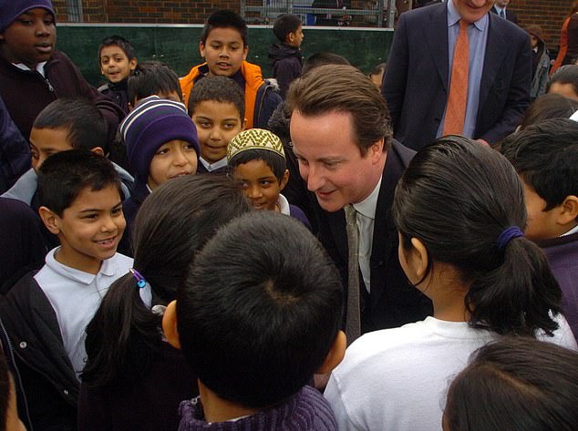 David Cameron, Conservative Party leader, talks to school children at Kobi Nazrul Primary School