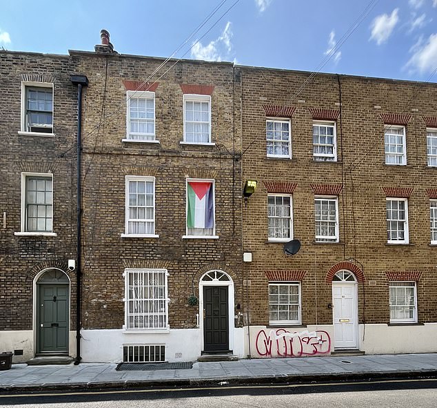 Palestinian flags flutter from windows or are painted onto the grills of shopfronts and street signs warning of 'No ball games' are written in Bengali as well as English