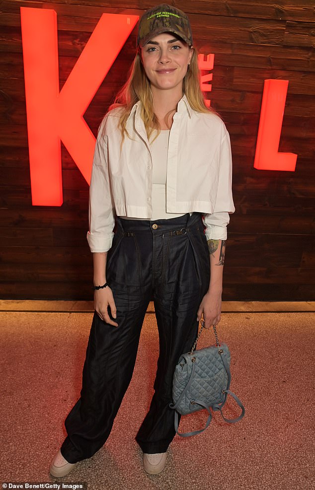 Celebrating the show, Cara, who identifies as queer and pansexual, cut a trendy figure a pair of black baggy cargo trousers, a cropped white shirt and trainers