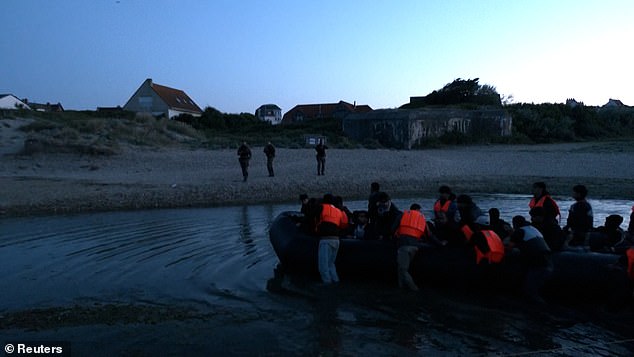 After facing criticism for standing around and even taking photographs of would-be migrants in previous weeks, police challenged the group and the boat came to a halt