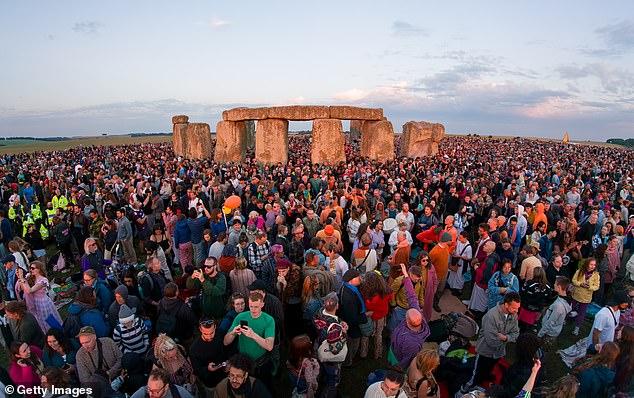 Those who gathered for the spectacle at the neolithic monument in Wiltshire braved a warm start to the morning as they marked the year's longest day