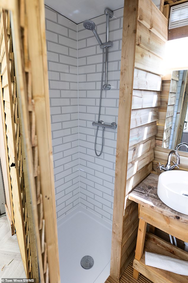 Not a stinky loo in sight, the sprawling tent features real beds and tiled en-suite showers