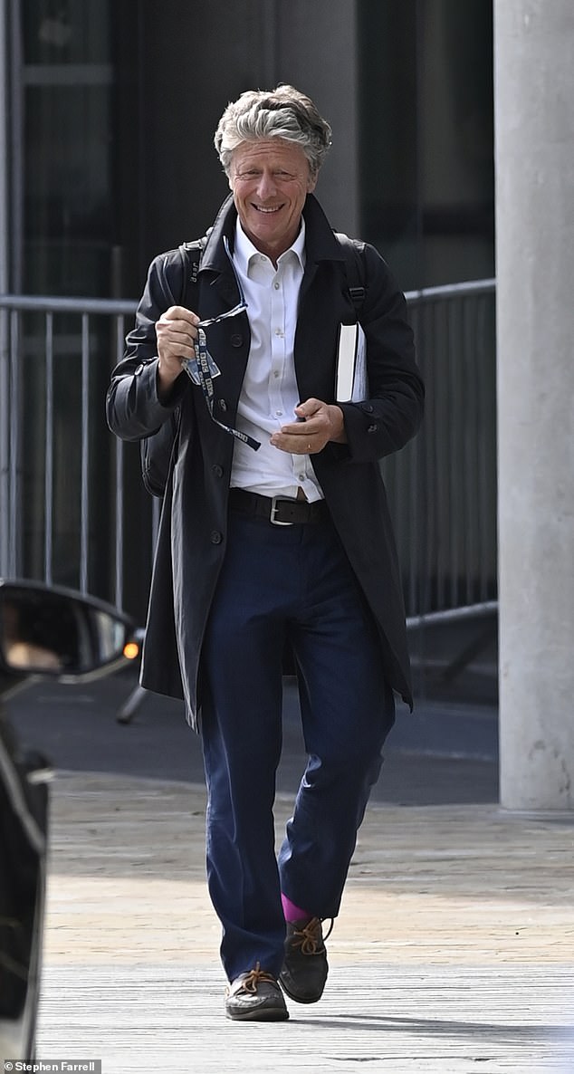 Elsewhere her Charlie Stayt, 63, (pictured) briefly smiled as he left the BBC building, wearing a black coat, coupled with a white shirt and a pair of navy trousers