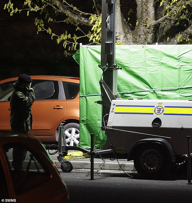 A bomb disposal expert stands by an area cordoned off for a controlled explosion outside Ibrahim's home in 2008