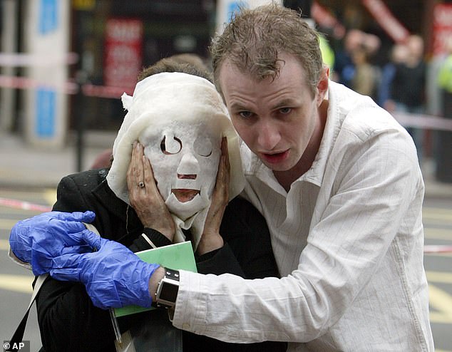 Injured commuter Davinia Turrell, 24, was helped away from Edgware Road tube station with dressings on her facial injuries by part-time fireman Paul Dadge, 28, in what became an iconic image from the attacks in which 56 people were killed and 784 were injured