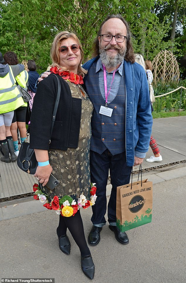 The presenter also had to contend with bullying in school which occured after he was diagnosed with alopecia and lost his hair (pictured with Lili in 2021)
