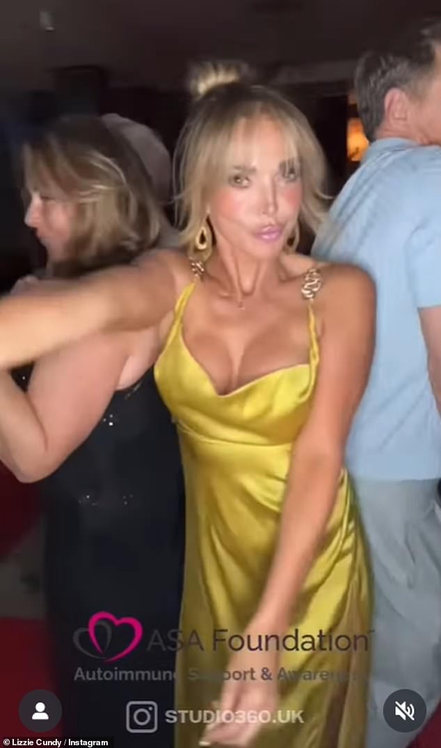 Lizzie Cundy cut a glamorous figure in a yellow dress with a low cut neckline and styled her locks into an updo