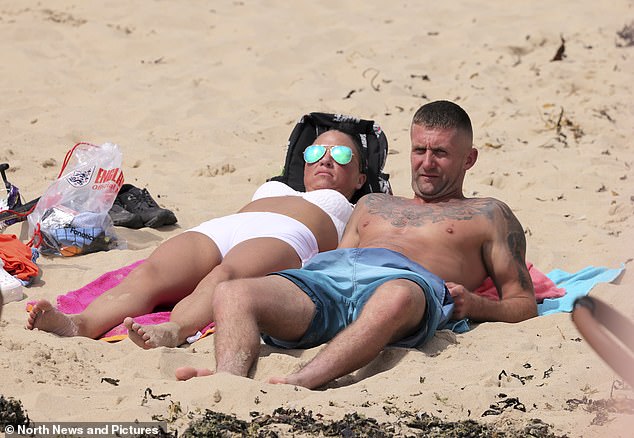 NORTH TYNESIDE: A couple basking in the summer heat which is gripping large parts of the country