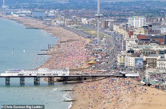 BRIGHTON: Thousands of beachgoers armed with umbrellas and sun-screen on the Sussex beach