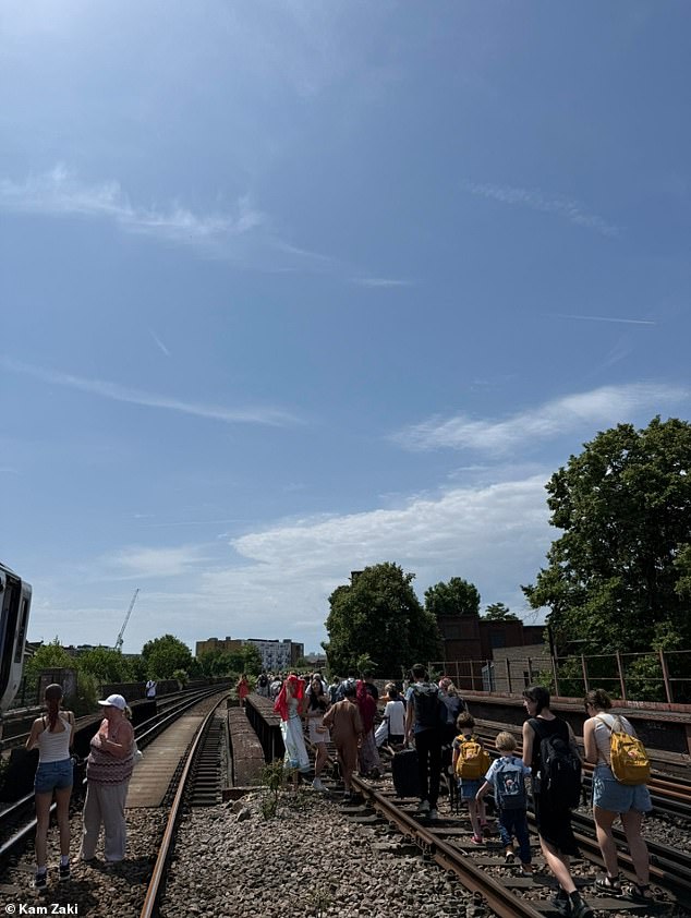 But on the junction between Elephant & Castle and Loughborough Junction, the train came to a grinding halt at around 11am and it took 10 minutes before passengers were informed that there was a problem (Picture taken by Mr Zaki on the track)