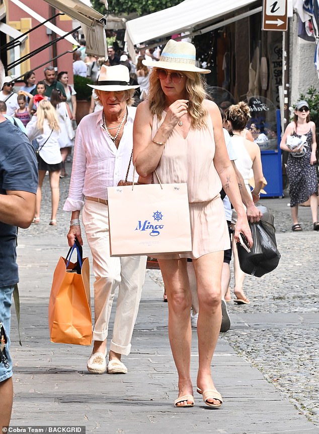 Penny and Sir Rod wore hats to protect themselves from the sun as they purchased items from shops including Mingo and Louis Vuitton