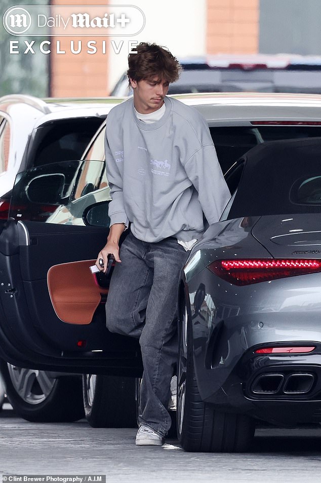 'In the process of becoming a mama¿s boy, he is losing his close bond with his brother, who is still in Hawaii,' our insider said (Jayden pictured in the $200k Mercedes his mom gifted him)