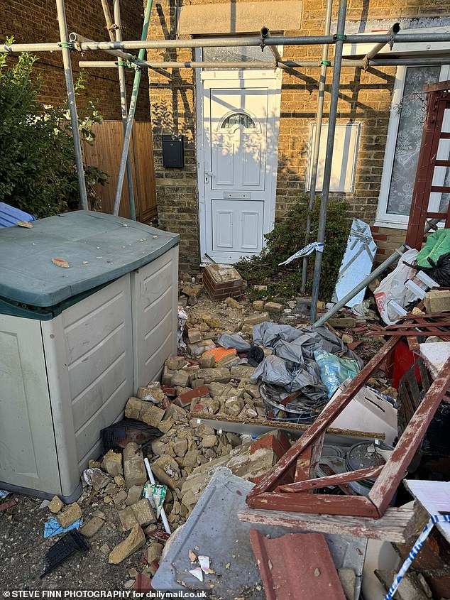 There were also fears the house is a hazard, with neighbours warned not to venture near. Pictured: Torn out bits of brick