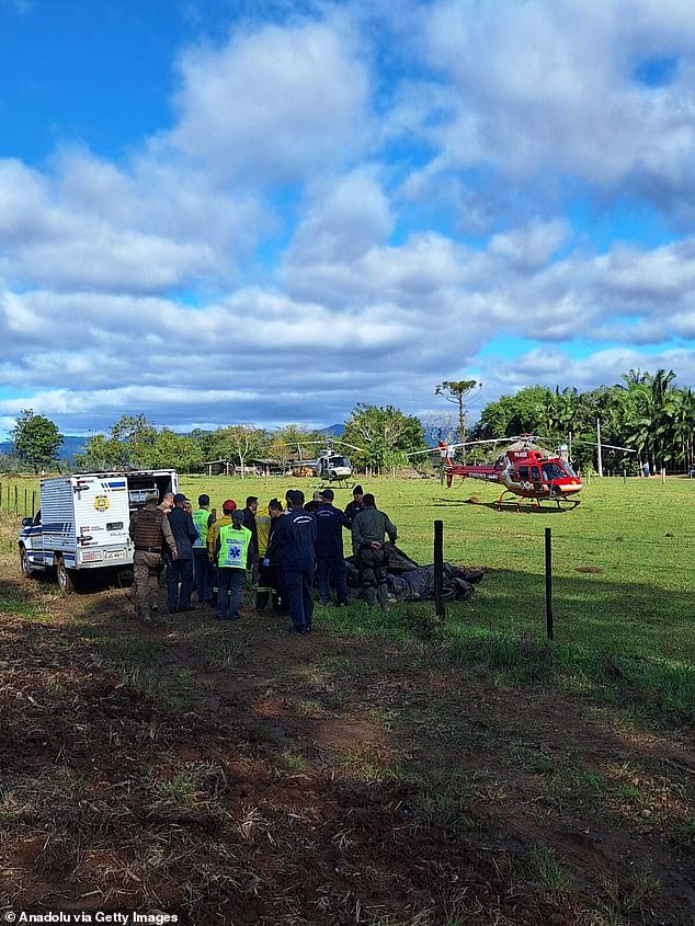 Emergency services operate at the area where a hot air balloon crashed, leaving at least 8 dead in Santa Catarina