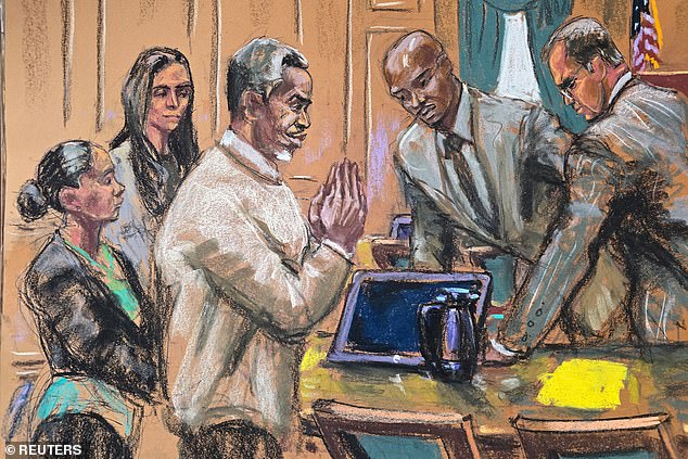 Diddy is pictured in court behind the defense table with his lawyers on Wednesday, June 18