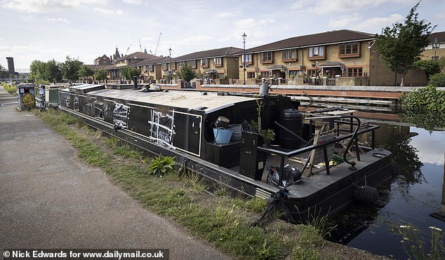 The remains of the canal boat are still docked for now in Hackney Wick, east London