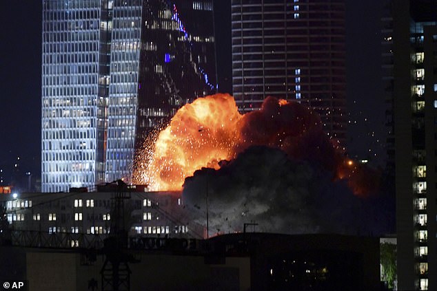 An Iranian missile attack creates a huge fireball as it explodes in Tel Aviv, Israel on June 13, 2025