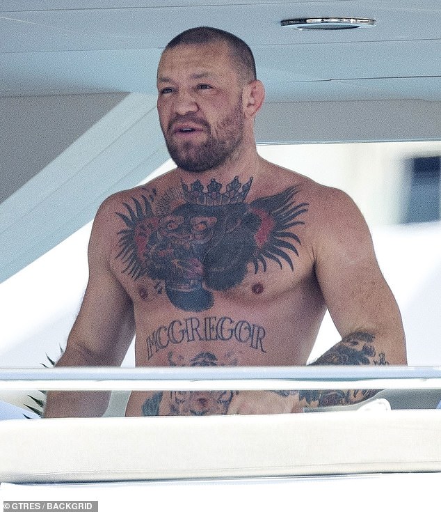 McGregor was seen shirtless but appearing to have a mark by his left eye