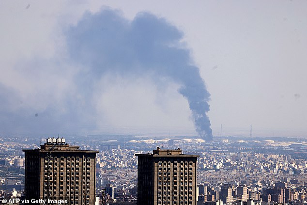 Pictured: The aftermath of an Israeli strike on an oil refinery in Tehran, Iran's capital city