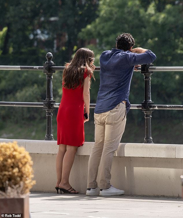 Sebastien and the 'mystery' women looked over the railings across the River Thames