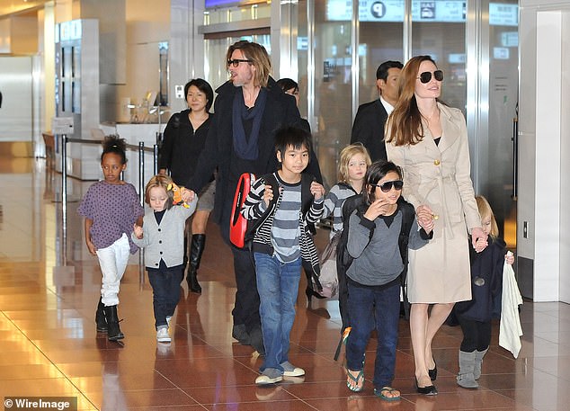 After Zahara stepped out with what appeared to be an engagement ring, Pitt was reportedly 'devastated.' He reportedly learned about the engagement rumors online, which was like a 'punch in the gut' since he hadn't heard anything about it from his daughter; pictured November 2011 in Tokyo
