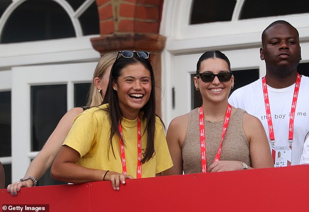 Raducanu is seen on the balcony at Queen's club watching Alcaraz