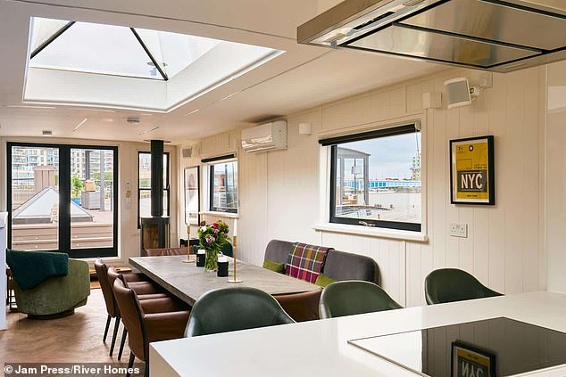 It is complete with panoramic Thames views, bespoke interiors, and modern comforts designed for year-round living