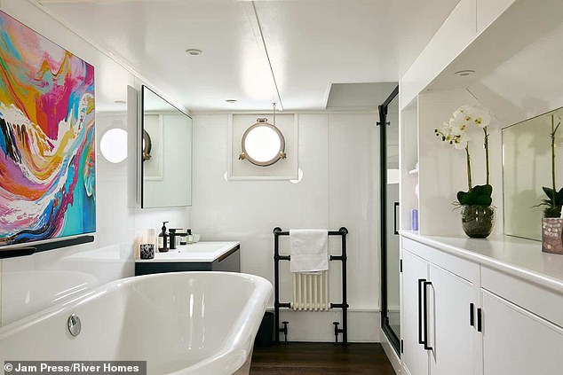 The barge boasts of a luxurious en-suite bathroom with a roll-top bath and separate shower