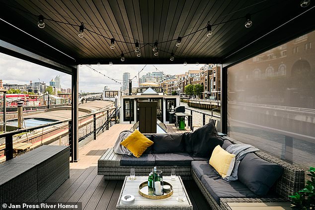 Sitting area on the Spitz barge previously used to transport grain and transformed into luxury home