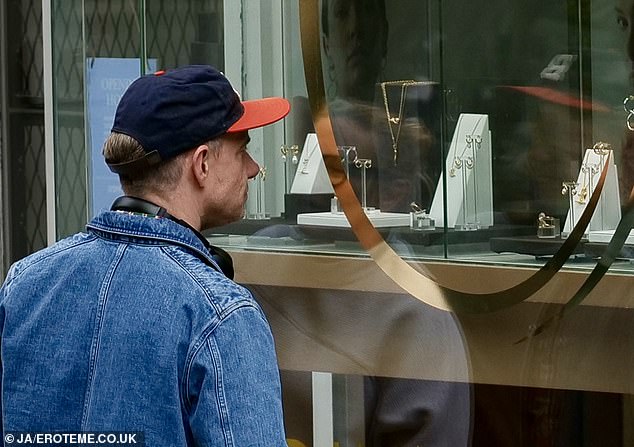 A source told The Sun : 'Martin looked intent on a particular show-stopping ring in the front and centre of the window display'