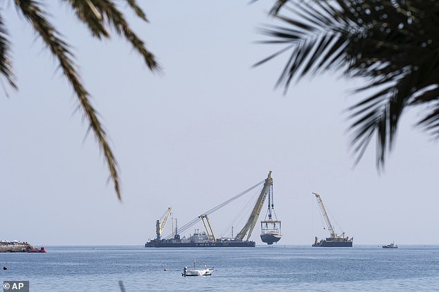 She was brought to the surface by 16 sets of cables - four at the bow and four at the stern