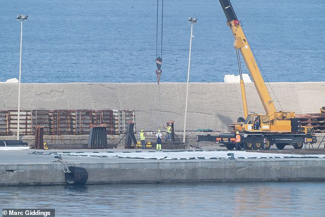 A white tarpaulin has been placed under the stilts which will capture any of the 18,000 litres of fuel that are still onboard