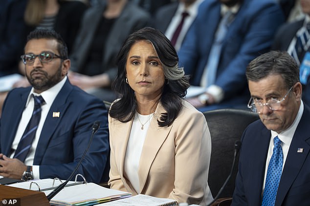 Director of National Intelligence Tulsi Gabbard, center, is flanked by FBI Director Kash Patel, left, and CIA Director John Ratcliffe, as the Senate Intelligence Committee holds its worldwide threats hearing, on Capitol Hill in Washington, Tuesday, March 25, 2025. Gabbard recently brought staff who oversee the PDB from CIA to ODNI