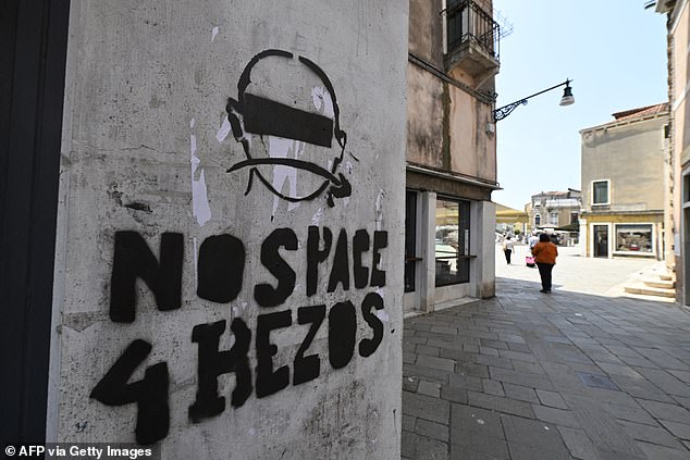 Graffiti, posters and banners protesting Jeff's presence in the Italian city have appeared in recent days ahead of his and Lauren's lavish wedding