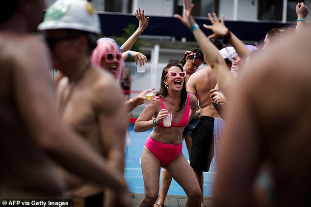 Revellers attend a party during 'The Invasion of the Pines' in Fire Island, which takes place every Fourth of July since 1976. Picture: 2021